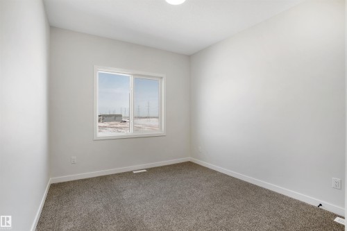 Spare room featuring baseboards and carpet floors - 116 25 Street, Edmonton, AB - Indoor Photo Showing Other Room