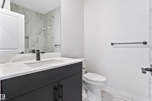 Bathroom with marble finish floors and vanity - 116 25 Street, Edmonton, AB - Indoor Photo Showing Bathroom