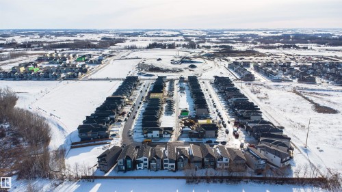 Snowy aerial view featuring a residential view - 116 25 Street, Edmonton, AB - Outdoor With View