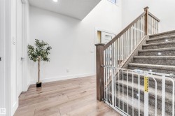 Stairs featuring wood finished floors and recessed lighting - 