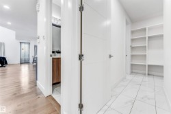 Corridor with baseboards and recessed lighting - 