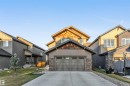 Craftsman-style house with driveway, stone siding, and board and batten siding - 1407 Graydon Hill Way, Edmonton, AB  - Outdoor With Facade 
