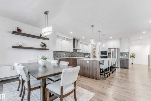 Dining room with light wood finished floors and recessed lighting - 1407 Graydon Hill Way, Edmonton, AB - Indoor Photo Showing Dining Room