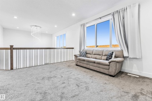 Carpeted living room with recessed lighting and baseboards - 1407 Graydon Hill Way, Edmonton, AB - Indoor