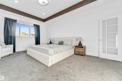 Bedroom featuring carpet, recessed lighting, and a raised ceiling - 