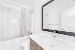 Bathroom with shower / bathtub combination with curtain and vanity - 