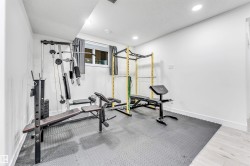 Exercise room featuring baseboards and recessed lighting - 