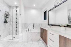 Full bath with vanity, a bath, a marble finish shower, and recessed lighting - 