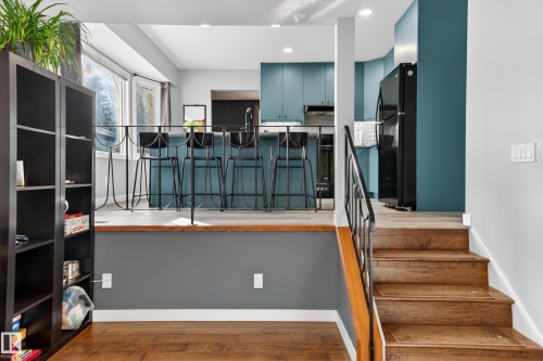 Stairs featuring wood finished floors and recessed lighting - 9215 Ottewell Road, Edmonton, AB - Indoor Photo Showing Other Room