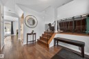 Stairs with hardwood / wood-style floors and a textured ceiling - 9215 Ottewell Road, Edmonton, AB  - Indoor Photo Showing Other Room 
