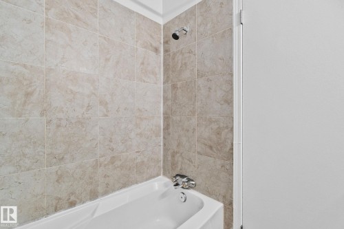Bathroom with bathing tub / shower combination - 4631 126 Avenue, Edmonton, AB - Indoor Photo Showing Bathroom
