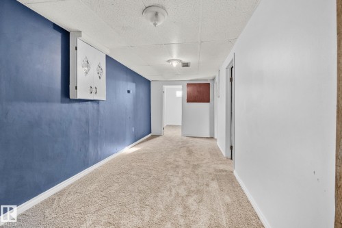 Hallway featuring a paneled ceiling and carpet floors - 4631 126 Avenue, Edmonton, AB - Indoor Photo Showing Other Room