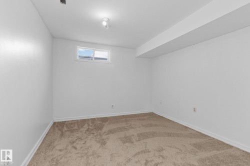 Basement with carpet and baseboards - 4631 126 Avenue, Edmonton, AB - Indoor Photo Showing Other Room
