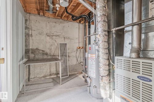 Utilities with heating unit and water heater - 4631 126 Avenue, Edmonton, AB - Indoor Photo Showing Basement