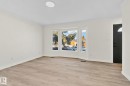 Spare room with light wood-type flooring and crown molding - 4631 126 Avenue, Edmonton, AB  - Indoor 
