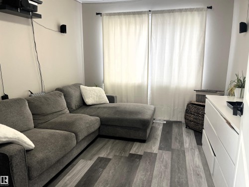 Living room featuring wood finished floors - 4811 48 Ave, Evansburg, AB - Indoor Photo Showing Living Room