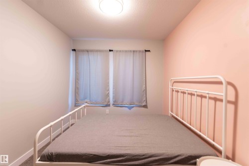 Bedroom featuring a textured ceiling - 21 1729 Keene Crescent, Edmonton, AB - Indoor