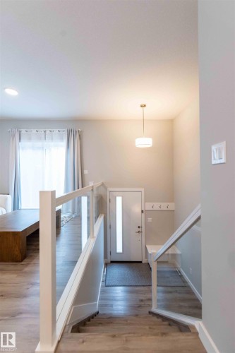 Foyer with stairs and light wood-type flooring - 21 1729 Keene Crescent, Edmonton, AB - Indoor Photo Showing Other Room