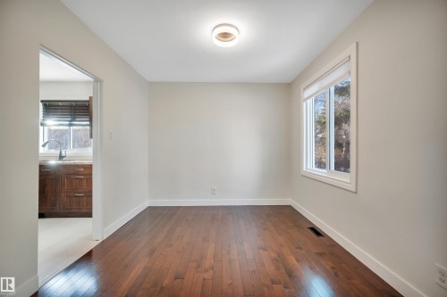 Unfurnished room featuring dark wood finished floors and baseboards - 6803 112A Street, Edmonton, AB - Indoor Photo Showing Other Room