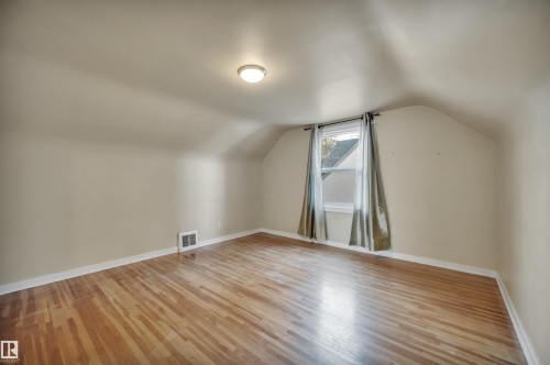 Additional living space with light wood-type flooring - 6803 112A Street, Edmonton, AB - Indoor Photo Showing Other Room