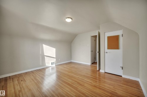 Additional living space with lofted ceiling and light wood-type flooring - 6803 112A Street, Edmonton, AB - Indoor Photo Showing Other Room