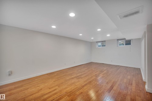 Basement featuring light wood-style floors and recessed lighting - 6803 112A Street, Edmonton, AB - Indoor