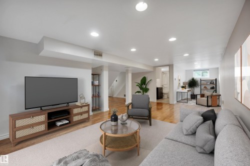 Living area with wood finished floors and recessed lighting - 6803 112A Street, Edmonton, AB - Indoor Photo Showing Living Room