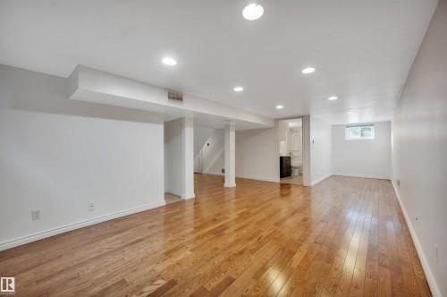 Below grade area with light wood-type flooring and recessed lighting - 6803 112A Street, Edmonton, AB - Indoor Photo Showing Other Room