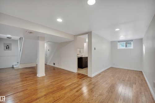 Basement with light wood-style floors, recessed lighting, and electric panel - 6803 112A Street, Edmonton, AB - Indoor Photo Showing Other Room
