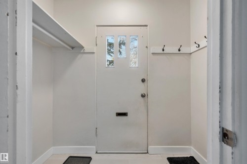 Laundry area with baseboards - 6803 112A Street, Edmonton, AB - Indoor Photo Showing Other Room