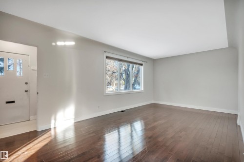 Entrance foyer with dark wood-style flooring - 6803 112A Street, Edmonton, AB - Indoor Photo Showing Other Room