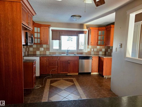 Edmonton, AB - Indoor Photo Showing Kitchen With Double Sink