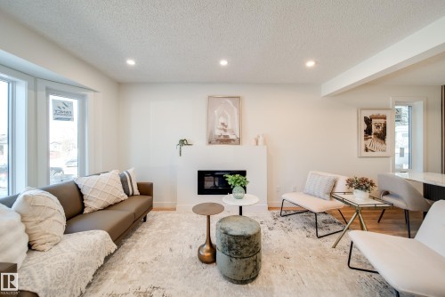 4019 37 Street, Edmonton, AB - Indoor Photo Showing Living Room With Fireplace