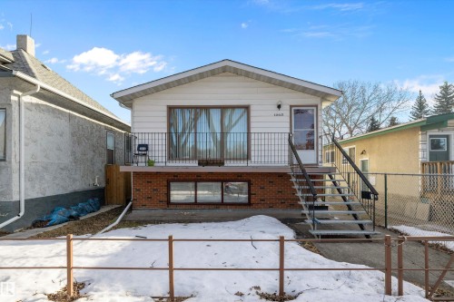 Snow covered house with a patio and brick siding - 12117 91 Street, Edmonton, AB - Outdoor