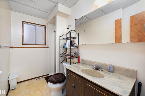 Full bathroom featuring vanity and curtained shower - 12117 91 Street, Edmonton, AB - Indoor Photo Showing Bathroom
