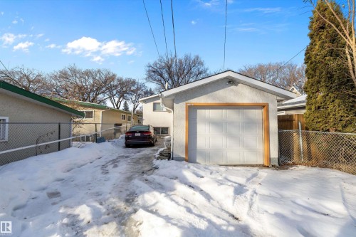 Snow covered garage with a garage - 12117 91 Street, Edmonton, AB - Outdoor