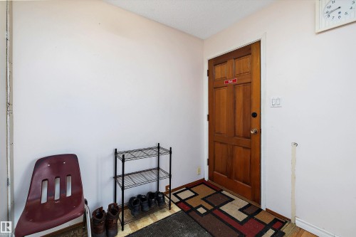 Foyer featuring a textured ceiling and baseboards - 12117 91 Street, Edmonton, AB - Indoor Photo Showing Other Room