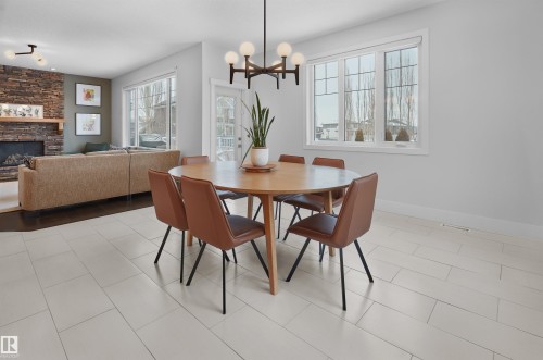 4212 Goresky Close, Edmonton, AB - Indoor Photo Showing Dining Room With Fireplace