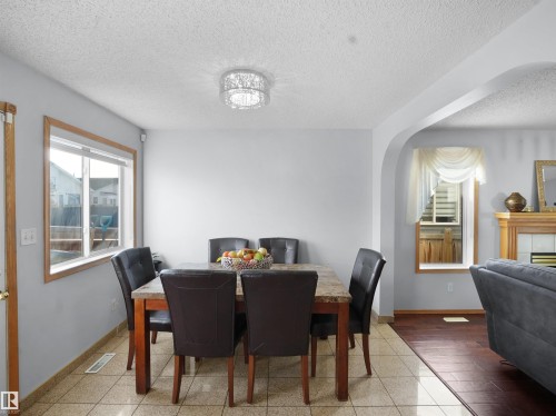 1238 Joyce Crescent, Edmonton, AB - Indoor Photo Showing Dining Room With Fireplace