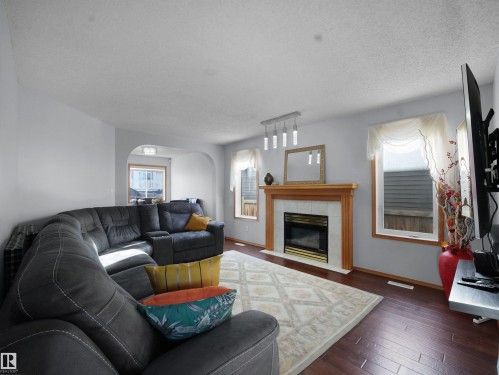 1238 Joyce Crescent, Edmonton, AB - Indoor Photo Showing Living Room With Fireplace