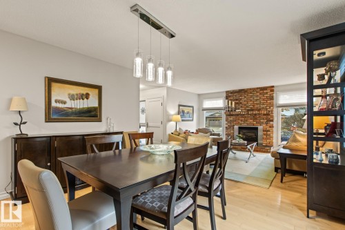 3 Wingate Place, St. Albert, AB - Indoor Photo Showing Dining Room With Fireplace