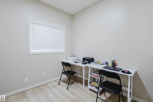 Home office with light wood finished floors and baseboards - 8420 Sloane Crescent, Edmonton, AB - Indoor Photo Showing Office