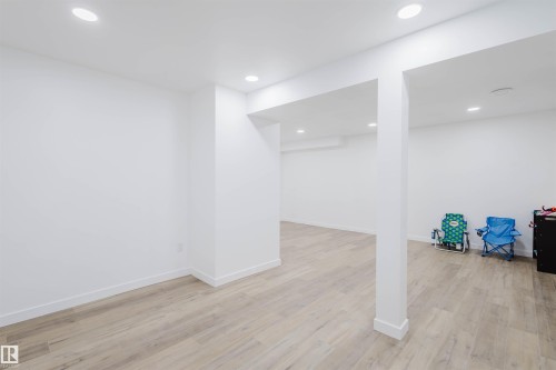 Finished basement with light wood-type flooring and recessed lighting - 8420 Sloane Crescent, Edmonton, AB - Indoor Photo Showing Other Room