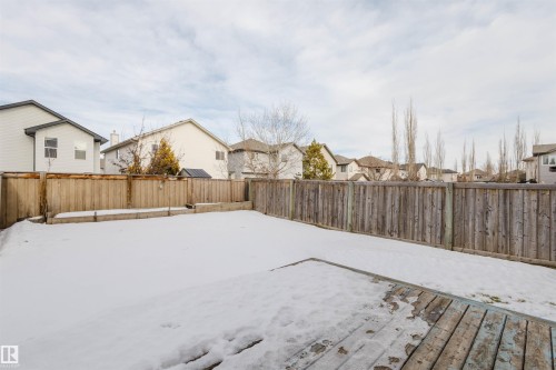 Fenced backyard featuring a residential view - 8420 Sloane Crescent, Edmonton, AB - Outdoor