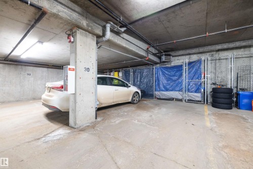 Parking garage with a heating unit - 205 8515 99 Street, Edmonton, AB - Indoor Photo Showing Garage