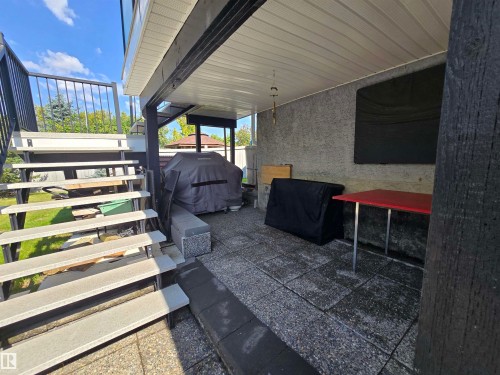 View of patio featuring area for grilling and stairs - 3772 30 Street, Edmonton, AB - Outdoor With Exterior