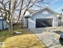 View of front of home with stucco siding, a gate, and driveway - 3772 30 Street, Edmonton, AB  - Outdoor 