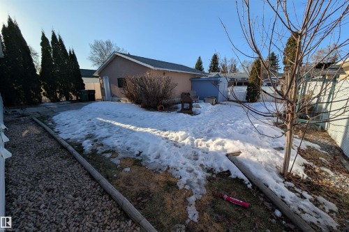 Snow covered property with stucco siding - 7 Mohawk Crescent, Leduc, AB - Outdoor