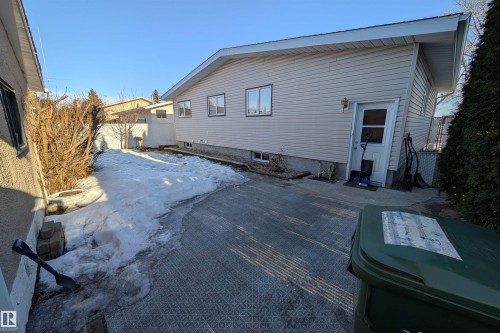 Snow covered property with a patio - 7 Mohawk Crescent, Leduc, AB - Outdoor With Exterior