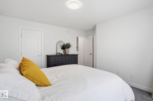Carpeted bedroom with baseboards - 16627 31 Avenue, Edmonton, AB - Indoor Photo Showing Bedroom